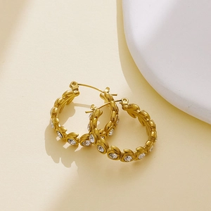 Hoop earrings with 18k gold plating, leaf texture, and sparkling cubic zirconia stones