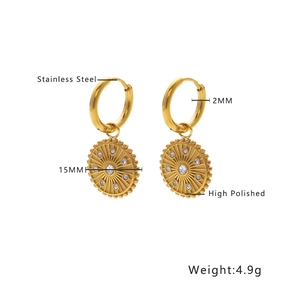 Detailed macro view of 18k gold plated stainless steel sunburst earrings with cubic zirconia