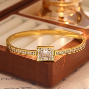 Detail of 18k gold plated stainless steel bracelet with rectangular zircon stone inlay