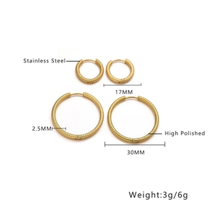 Detailed view of gold stainless steel hoop earrings with engraved texture and size specs