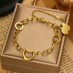 Golden titanium steel heart bracelet with hollow links and pendant on leather case