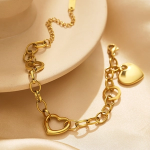 18k gold plated stainless steel chain bracelet with hollow and solid heart pendants