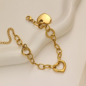 18K gold plated stainless steel chain bracelet featuring solid and hollow heart charms