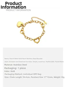 Detail view of gold 18k heart bracelet showing the chain link and hollow heart charms