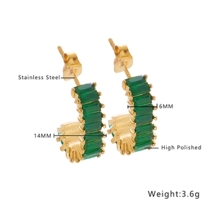Detail of emerald green zircon inlay on 14mm high polished gold stainless steel hoops