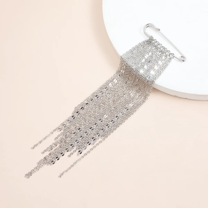 Modern silver tassel brooch with polished metal chain drapes and elegant safety pin design