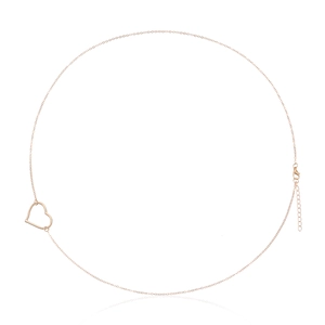 Macro detail of rose gold heart belly chain with lobster clasp and extension link