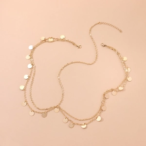 Double-layer gold body chain featuring polished sequin charms and wave fringe design