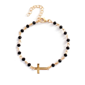Exquisite beaded cross bracelet with black faceted beads and adjustable gold clasp