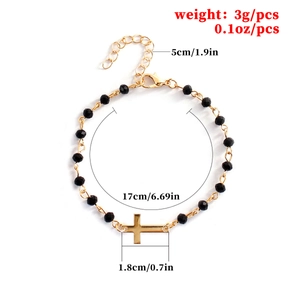 Beaded cross bracelet with black faceted beads and gold chain measuring 17cm plus extender