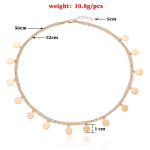 Minimalist double-layer gold chain necklace with polished round metal pendants