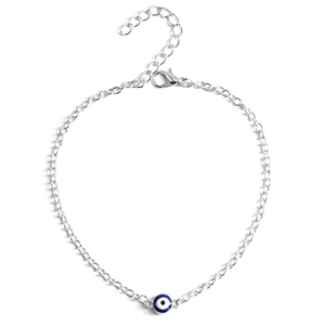 Detailed macro view of silver chain evil eye bracelet with adjustable lobster clasp