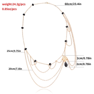 Multi-layer gold star body chain with black beads and engraved measurement labels