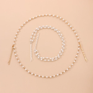Detail of single and double layer faux pearl hair chains with gold and silver metal clips
