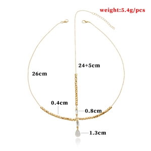 Classic gold alloy head chain with teardrop pendant and crystal beads on white background