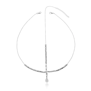 Detail of silver alloy head chain featuring drop pendant and faceted metallic beads