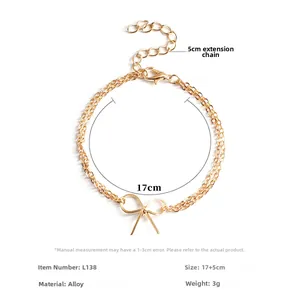 Minimalistisches doppellagiges Goldarmband mit Schleife und 5 cm Verlängerungskette