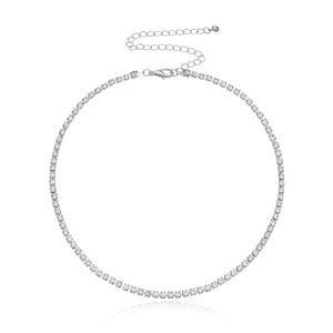 Detailed macro view of silver tennis necklace with crystal claw chain and lobster clasp