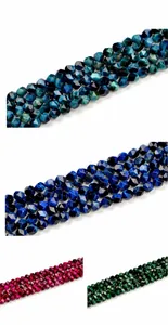 Macro view of multi-colored faceted star-shaped 8mm natural tiger eye stone beads