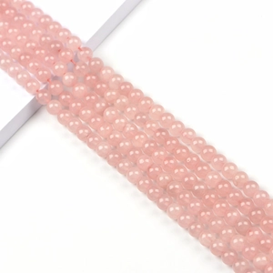 8mm natural rose quartz beads for DIY jewelry making on minimalist background