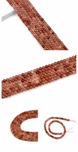 Macro shot of 6mm natural strawberry quartz beads with red inclusions and pink threading