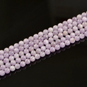 Natural 8mm lavender kunzite round beads for DIY jewelry making on black reflective background