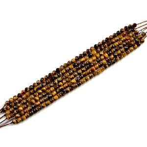 Faceted tiger eye stone beads in natural yellow and brown tones for jewelry making
