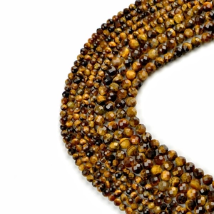 Faceted natural tiger eye loose beads in golden brown with shimmering cat eye effect
