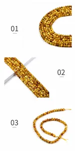 Détail macro de perles rondes en œil de tigre jaune 6mm avec effet œil de chat