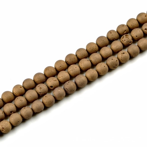 Dettaglio di perle di agata bronzo da 12mm con trama opaca porosa per gioielli fai da te