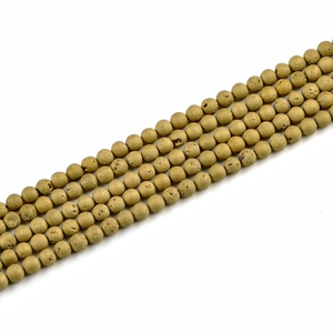 Detailed view of 8mm matte gold natural stone beads with raw druzy texture for jewelry making