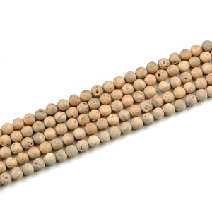 Detail of 8mm matte natural stone beads with raw texture for DIY jewelry making