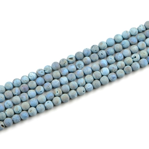 Macro detail of 8mm natural frosted stone beads with light blue druzy texture for DIY jewelry