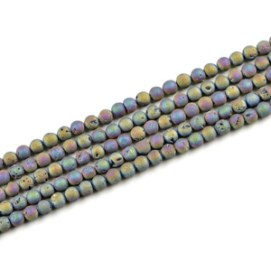 Macro shot of 8mm iridescent natural stone beads with raw crystal druzy texture for DIY
