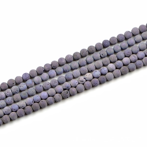 Detailed macro view of 8mm matte purple electroplated lava stone beads for jewelry making