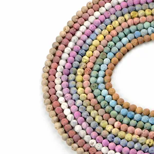 Multi-colored 8mm matte lava stone round beads arranged in concentric circles