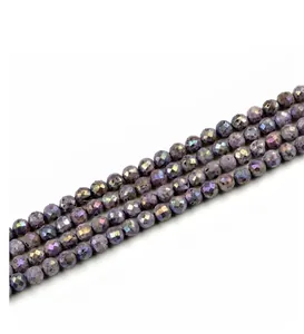 Detailed view of purple faceted agate beads with iridescent rainbow luster and precision cut