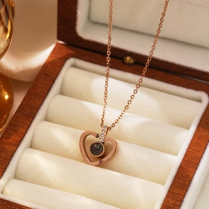 Rose gold heart projection necklace with 100 languages of I Love You in a wooden box