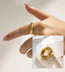 Detailed view of vacuum plated golden spinner ring with zircon stones on stone prop