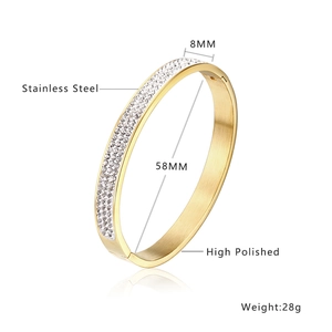 Gold-plated stainless steel bangle with row of zircons, width 8mm and inner diameter 58mm