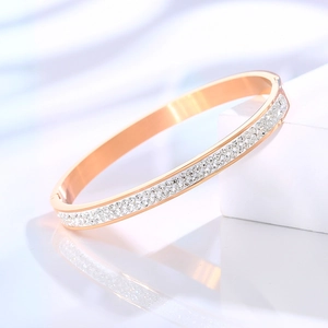 Detail view of rose gold plated bracelet with double rows of sparkling white zircons
