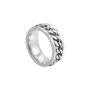 Macro detail of a silver stainless steel spinner ring with a Cuban link chain inlay
