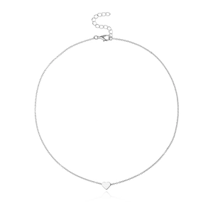 Minimalist silver heart pendant necklace with thin chain and lobster clasp on white background