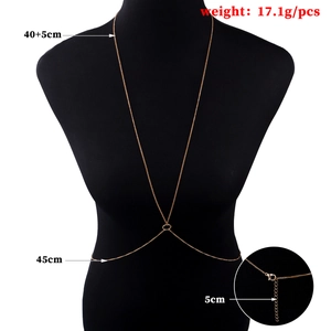 Golden body chain necklace on black mannequin featuring adjustable lobster clasp and chain