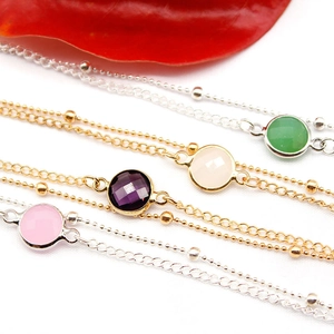 Set of four minimalist double-layered alloy anklets with round colorful gemstones