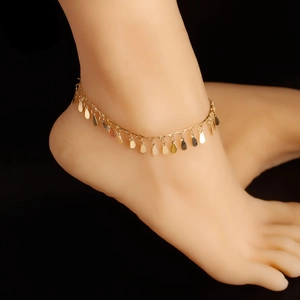 Elegant gold anklet for women featuring a minimalist teardrop charm design on foot