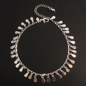 Minimalist silver anklet with dangling teardrop charms and adjustable lobster clasp closure