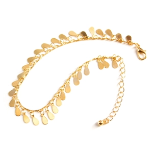 Detail of gold beach anklet with water drop pendants and lobster clasp closure