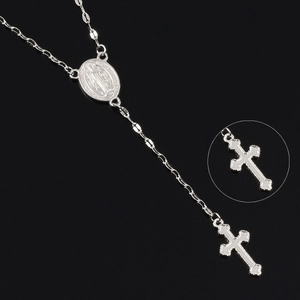 Silver rosary necklace with Virgin Mary medal and detailed crucifix pendant on black background
