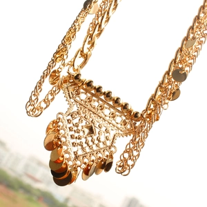 Detail of bohemian gold sequin waist chain featuring a triangle hollow pendant design
